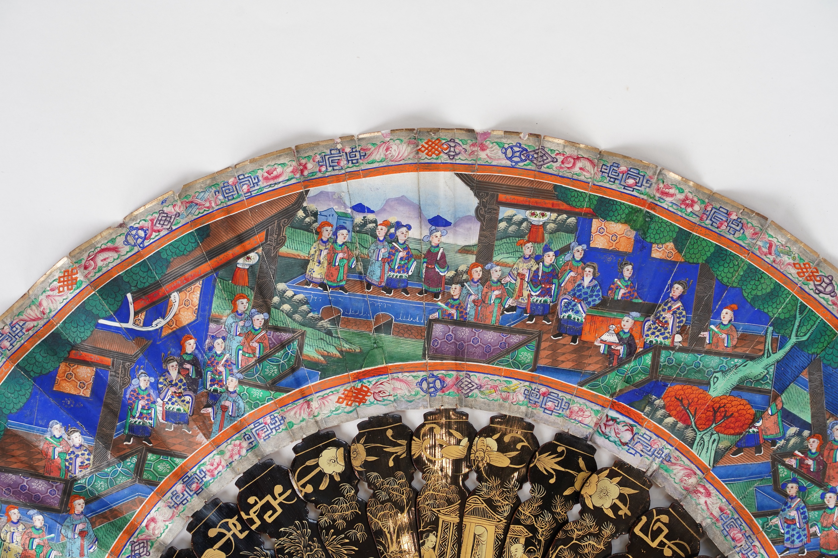Three Chinese gilt-decorated black lacquer and painted leaf fans, 19th century